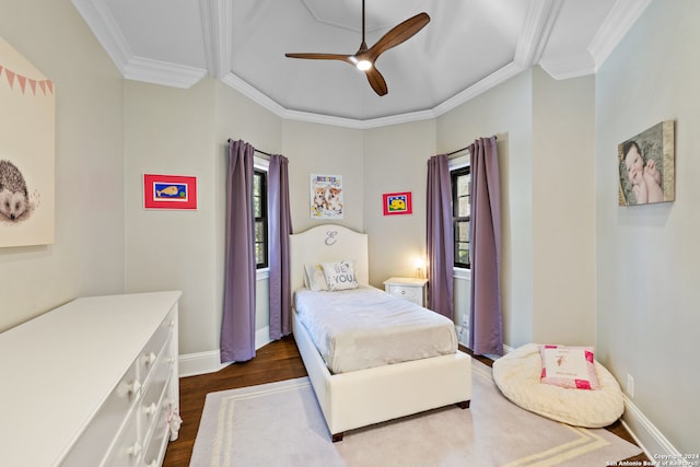 bedroom featuring ornamental molding, dark hardwood / wood-style floors, and ceiling fan