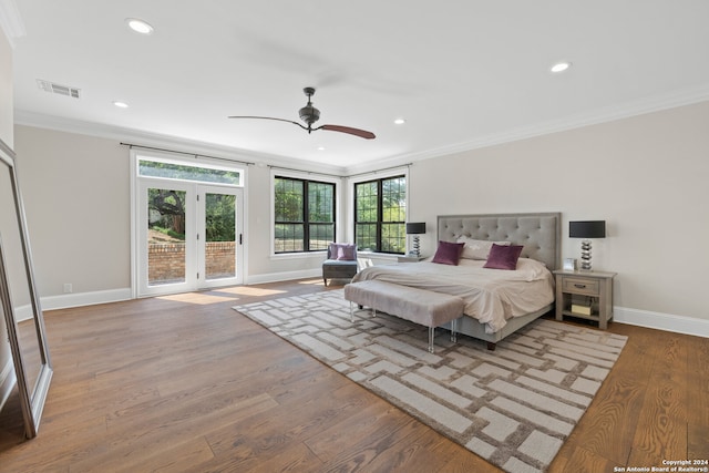 bedroom featuring crown molding, ceiling fan, french doors, and hardwood / wood-style flooring