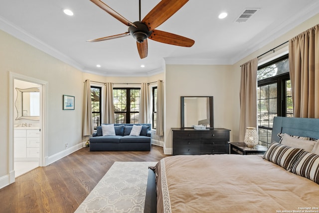 bedroom featuring multiple windows, wood-type flooring, ornamental molding, and ceiling fan