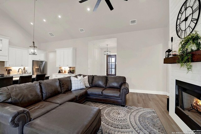 kitchen featuring light stone counters, a notable chandelier, sink, and appliances with stainless steel finishes