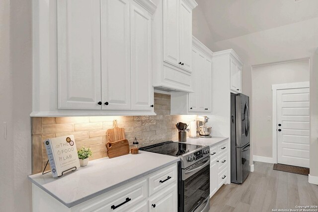 kitchen featuring a fireplace, ceiling fan with notable chandelier, plenty of natural light, sink, and a center island with sink