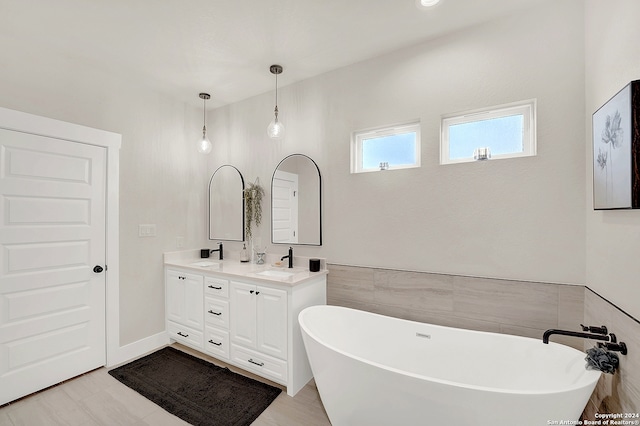 bathroom featuring a bathing tub and vanity