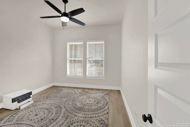 unfurnished room with ceiling fan and hardwood / wood-style floors