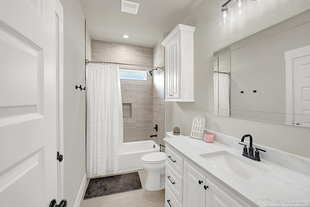 bathroom featuring visible vents, toilet, tile patterned flooring, shower / bath combination with curtain, and vanity