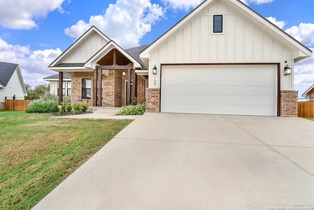 view of front of house featuring brick siding, board and batten siding, and a front lawn