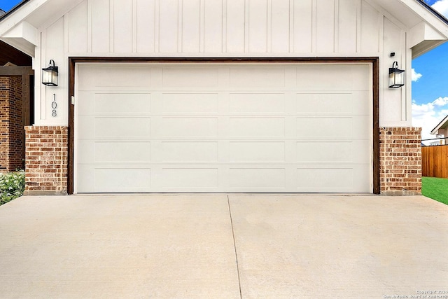 garage featuring concrete driveway