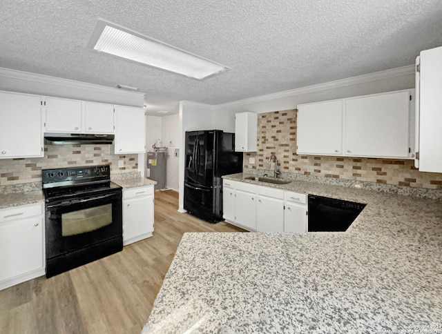 kitchen with a textured ceiling, black appliances, sink, decorative backsplash, and light wood-type flooring