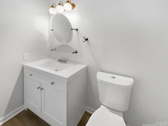 bathroom with toilet and vanity