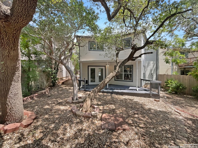 rear view of property with french doors