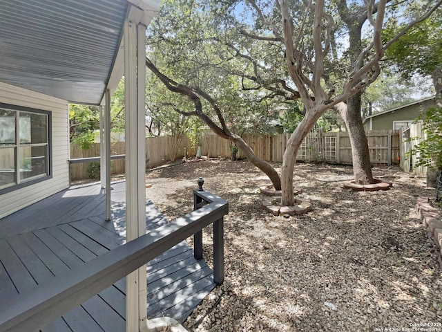 view of yard featuring a fenced backyard and a wooden deck