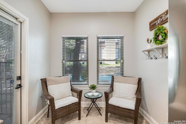 living area featuring light tile patterned flooring