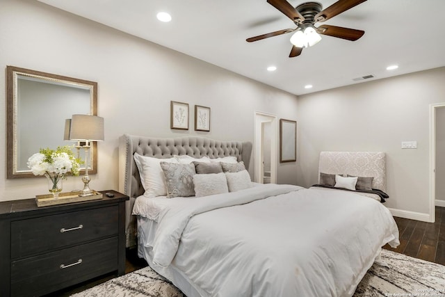 bedroom with recessed lighting, visible vents, dark wood-type flooring, a ceiling fan, and baseboards