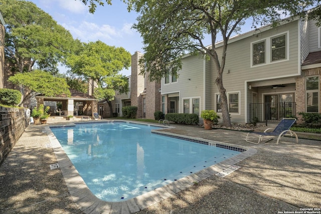 community pool with a patio area