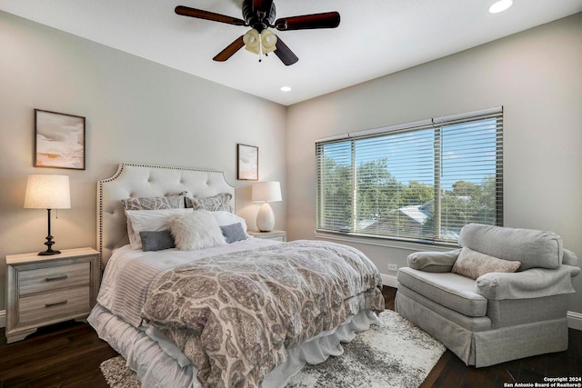 bedroom featuring dark hardwood / wood-style flooring and ceiling fan