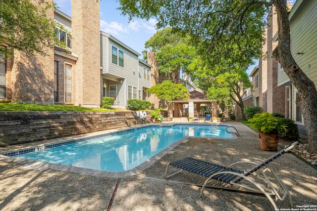 view of swimming pool with a patio area