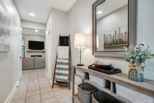 hall featuring light tile patterned floors