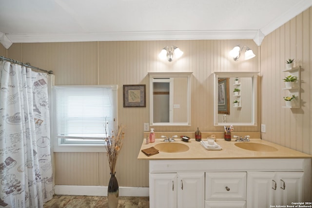 bathroom with vanity and ornamental molding