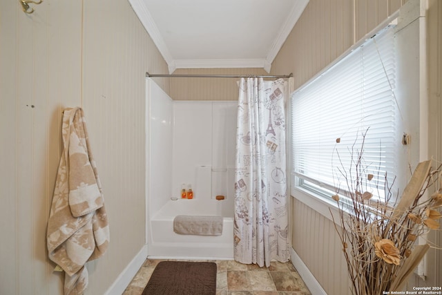 bathroom with ornamental molding and shower / bathtub combination with curtain