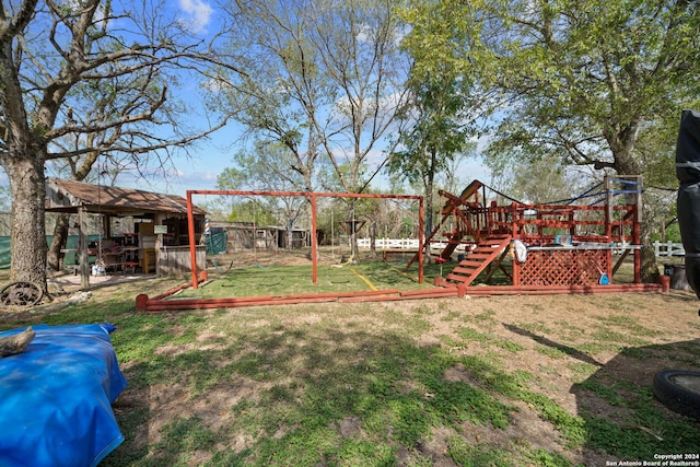 view of jungle gym with a yard