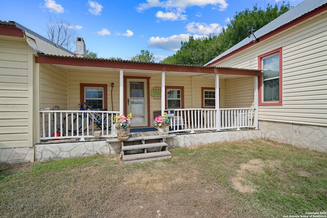 doorway to property with a porch