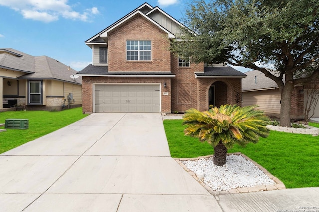 view of front facade with a garage and a front yard