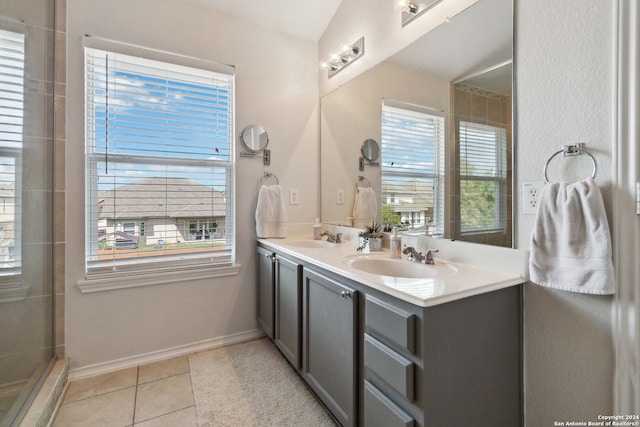 bathroom with tile patterned flooring, vanity, and an enclosed shower