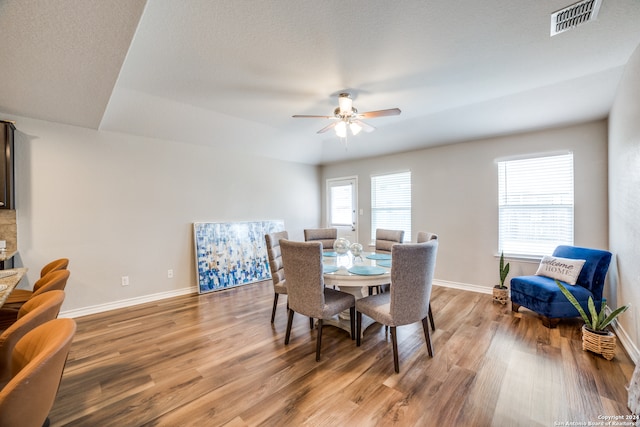 dining space featuring ceiling fan and hardwood / wood-style floors