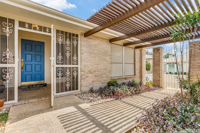 doorway to property featuring a pergola