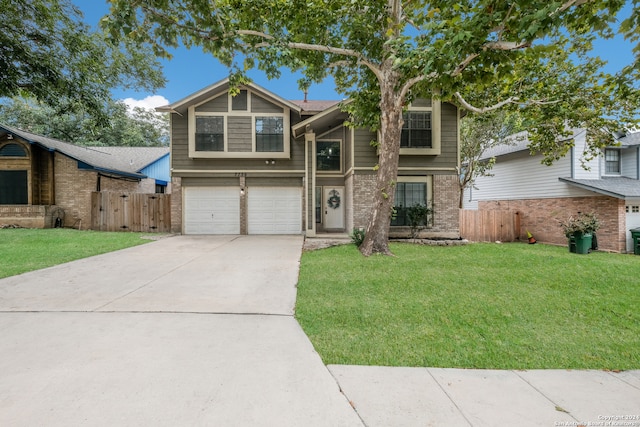 view of front of home featuring a garage and a front lawn