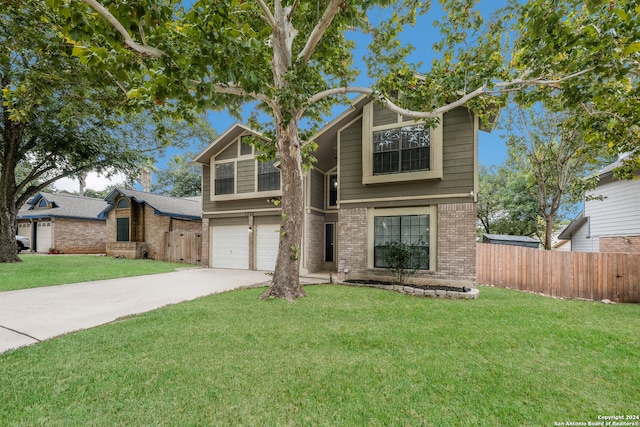 view of front of home featuring a garage and a front yard