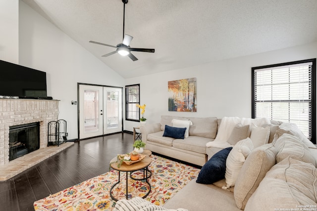 living room featuring a fireplace, french doors, high vaulted ceiling, dark wood-type flooring, and ceiling fan