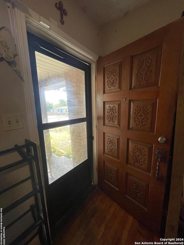 doorway to outside with dark hardwood / wood-style flooring