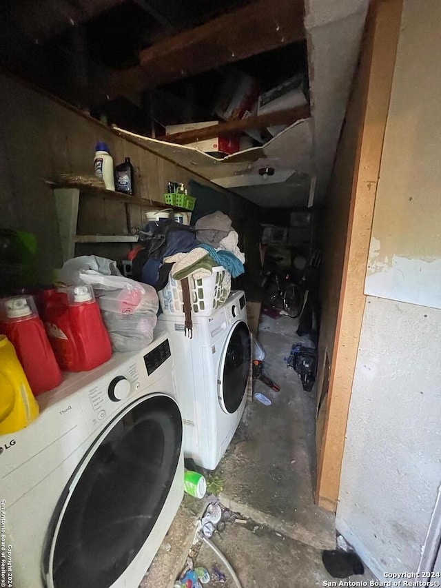 clothes washing area featuring independent washer and dryer