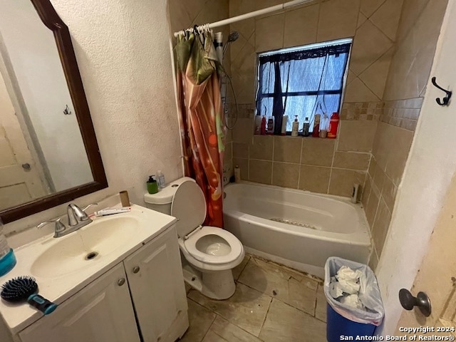 full bathroom with vanity, toilet, shower / tub combo, and tile patterned floors