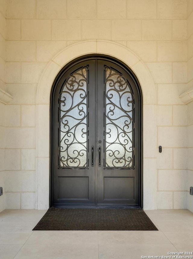 entrance to property with concrete block siding