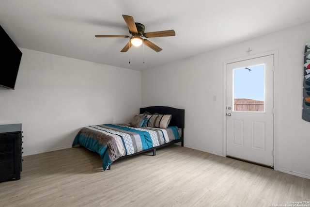 bedroom with ceiling fan and light hardwood / wood-style floors