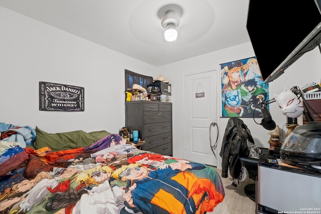 bedroom featuring hardwood / wood-style floors and ceiling fan