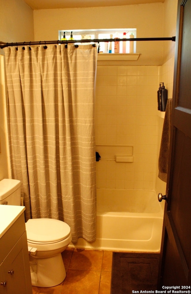 full bathroom featuring vanity, toilet, shower / bathtub combination with curtain, and tile patterned flooring