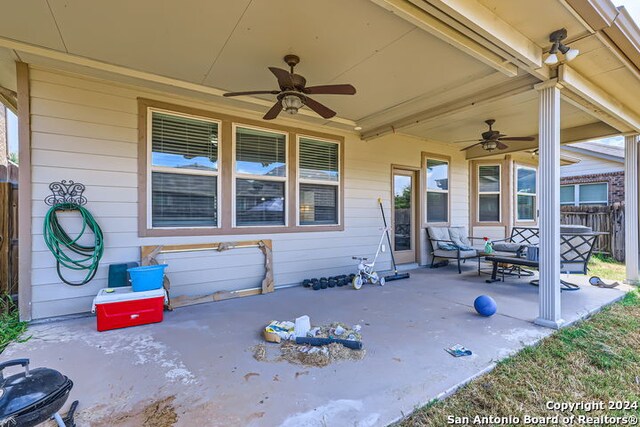 view of patio featuring ceiling fan