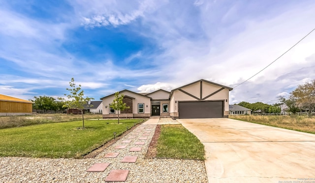 view of front of house with a front lawn and a garage