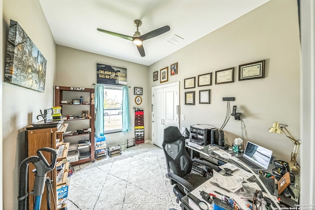 tiled office space featuring ceiling fan