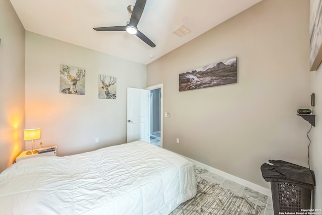 bedroom featuring ceiling fan and light tile patterned floors