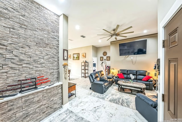 tiled living room featuring ceiling fan