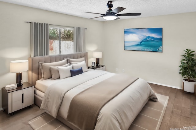 bedroom featuring a textured ceiling, ceiling fan, and hardwood / wood-style floors