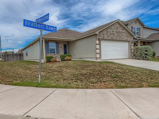 view of front of home featuring a garage and a front lawn