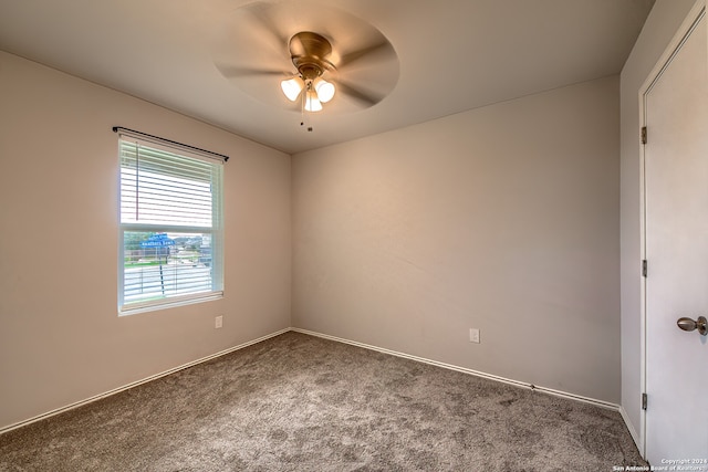 empty room featuring ceiling fan and carpet floors