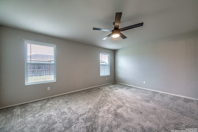 empty room featuring carpet and ceiling fan