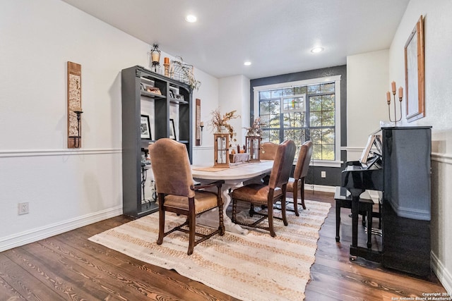 dining area featuring dark wood-type flooring