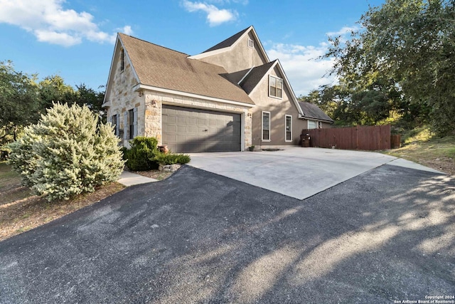 view of side of property with a garage