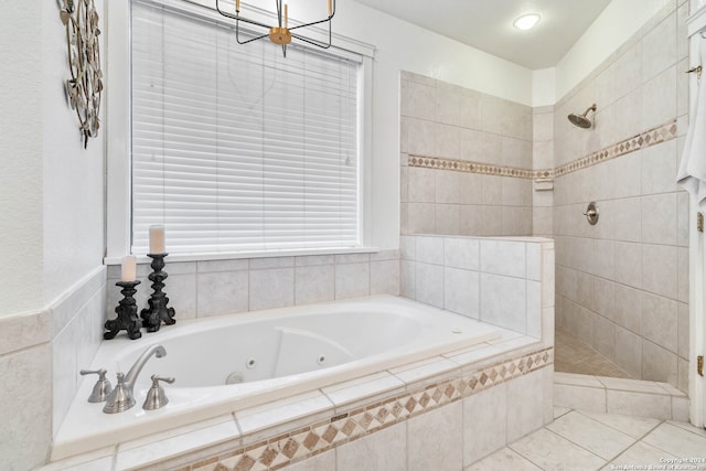 bathroom with shower with separate bathtub and tile patterned floors